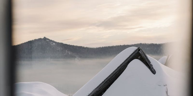 Silhouette of a person meditating at sunrise.